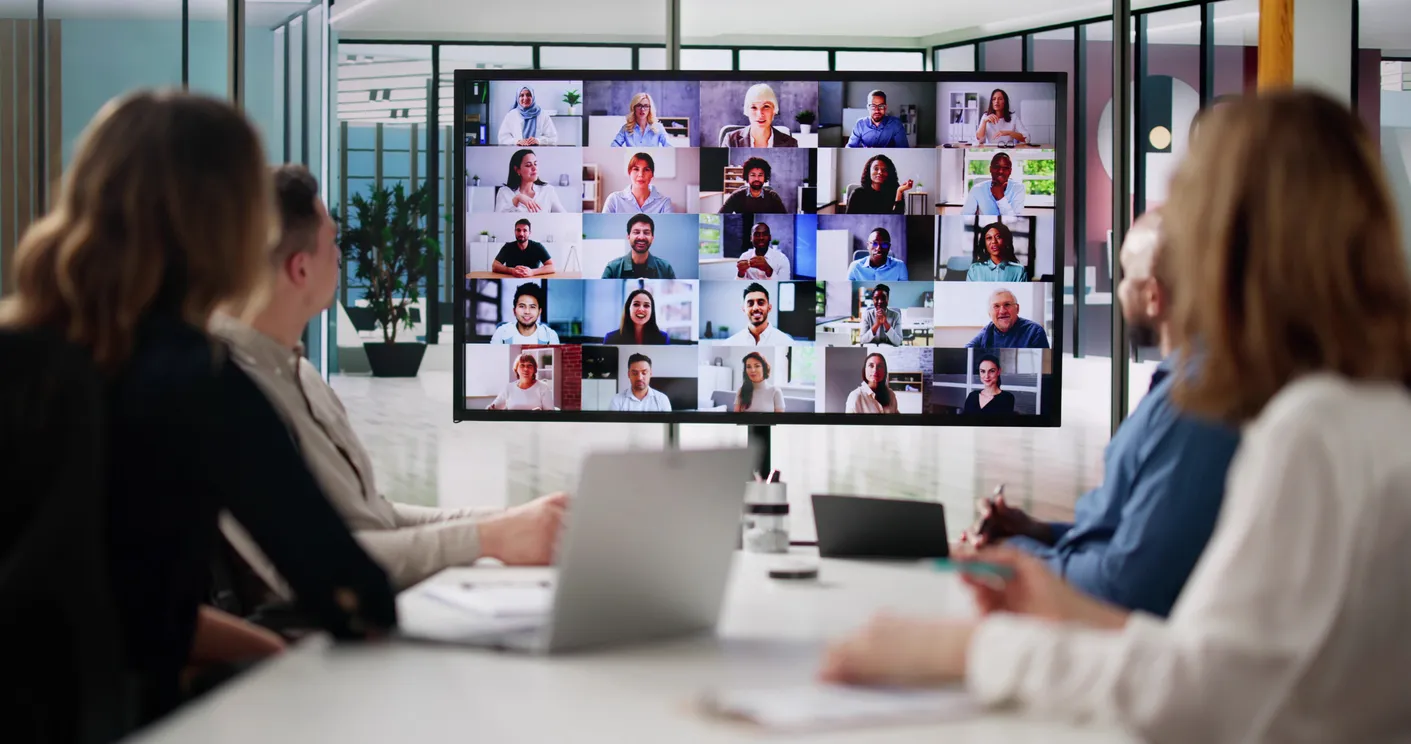 Remote team meeting on a video call, viewed from a computer screen.