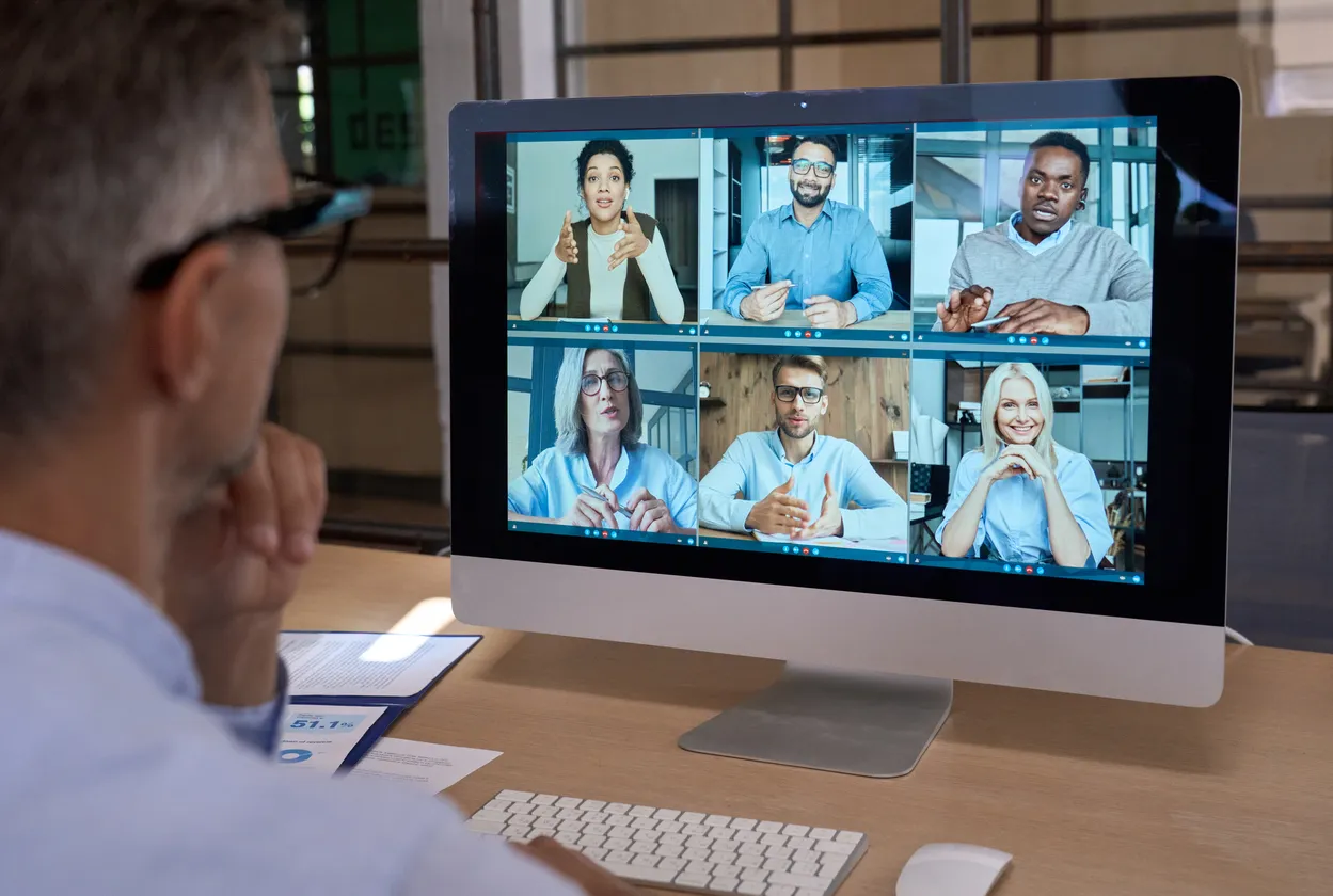 Financial operations team analyzing data and collaborating via screens.