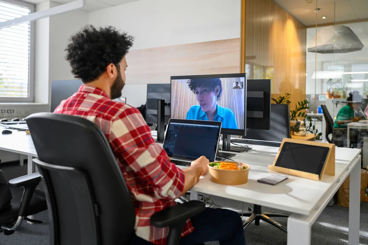 Tech-focused team in a high-energy workspace, engaged in a coding or planning session.
